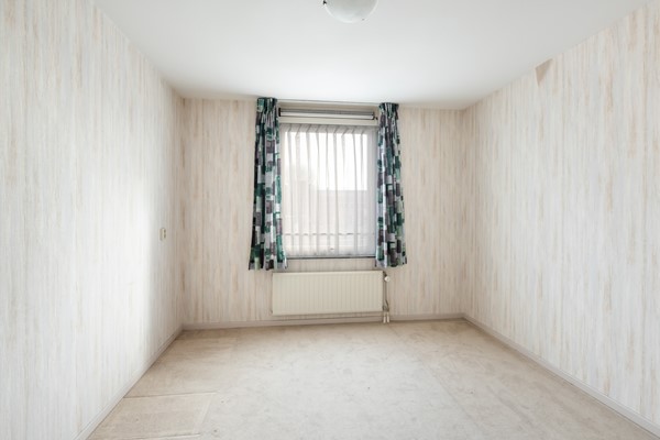 Foto - Te koop: Ruime dubbele benedenwoning met parkeerplaats!